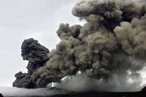 A plume of ash rises from a volcano erupting under the Eyjafjallajokull volcano, Hvolsvollur, Iceland, Wednesday, May 5, 2010. (AP Photo/Brynjar Gauti)